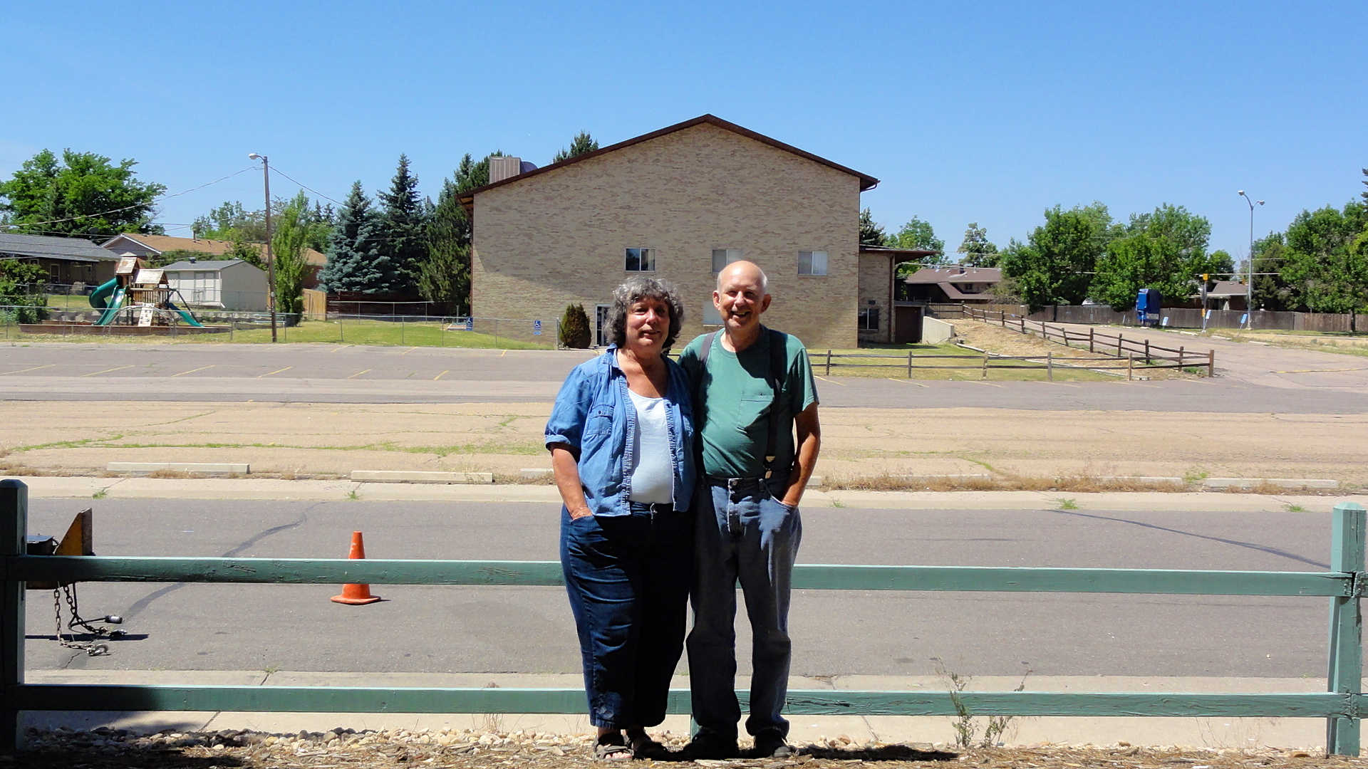 Here, Mom and Dad are standing in the parking lot of their first apartment, and the building behind them across the street is the church where they were married. The day of their wedding, they were both very sick, and they walked across the street for a simple wedding attended only by Chris and a work colleague of Dad's who had agreed to serve as a witness.