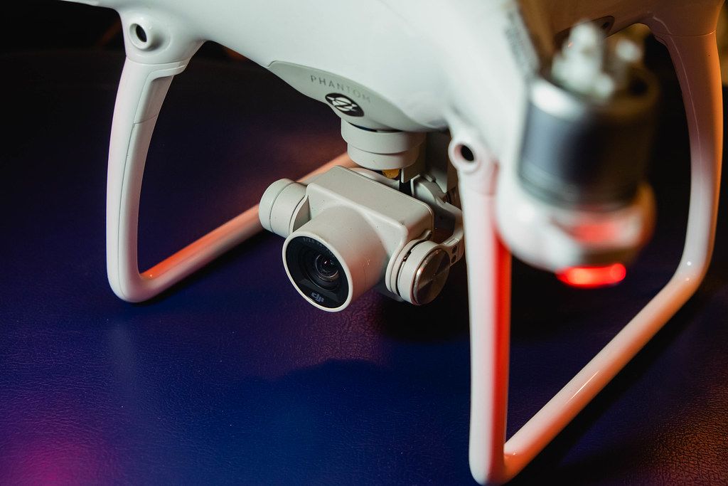 Drone dji mavic 2 zoom with camera on a white surface
