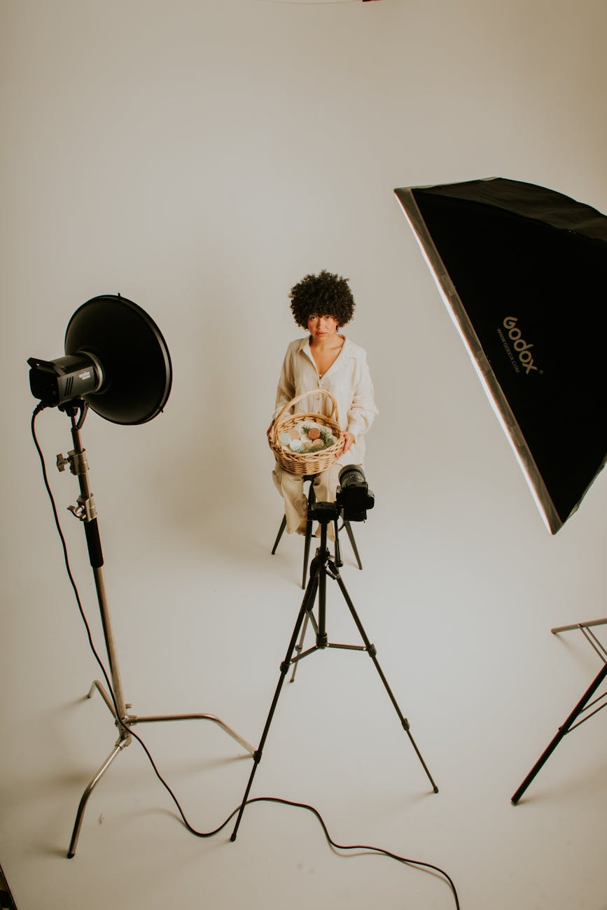 a woman sitting in a studio