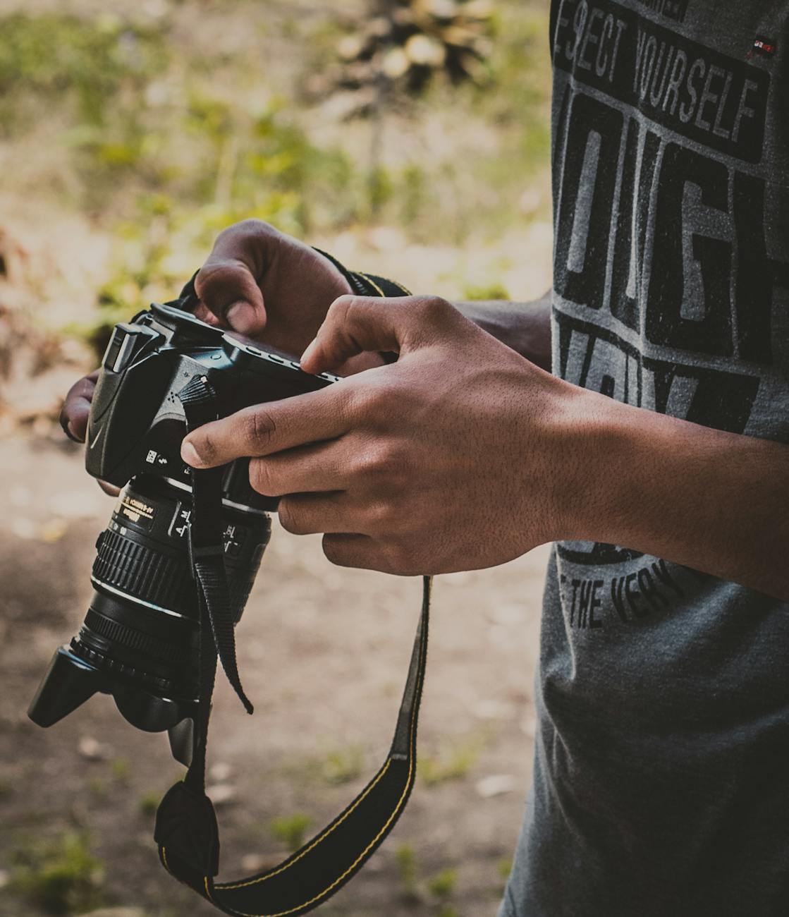 man holding dslr camera