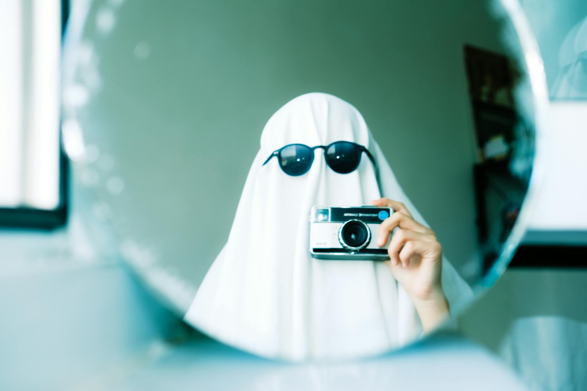 ghost taking pictures in mirror