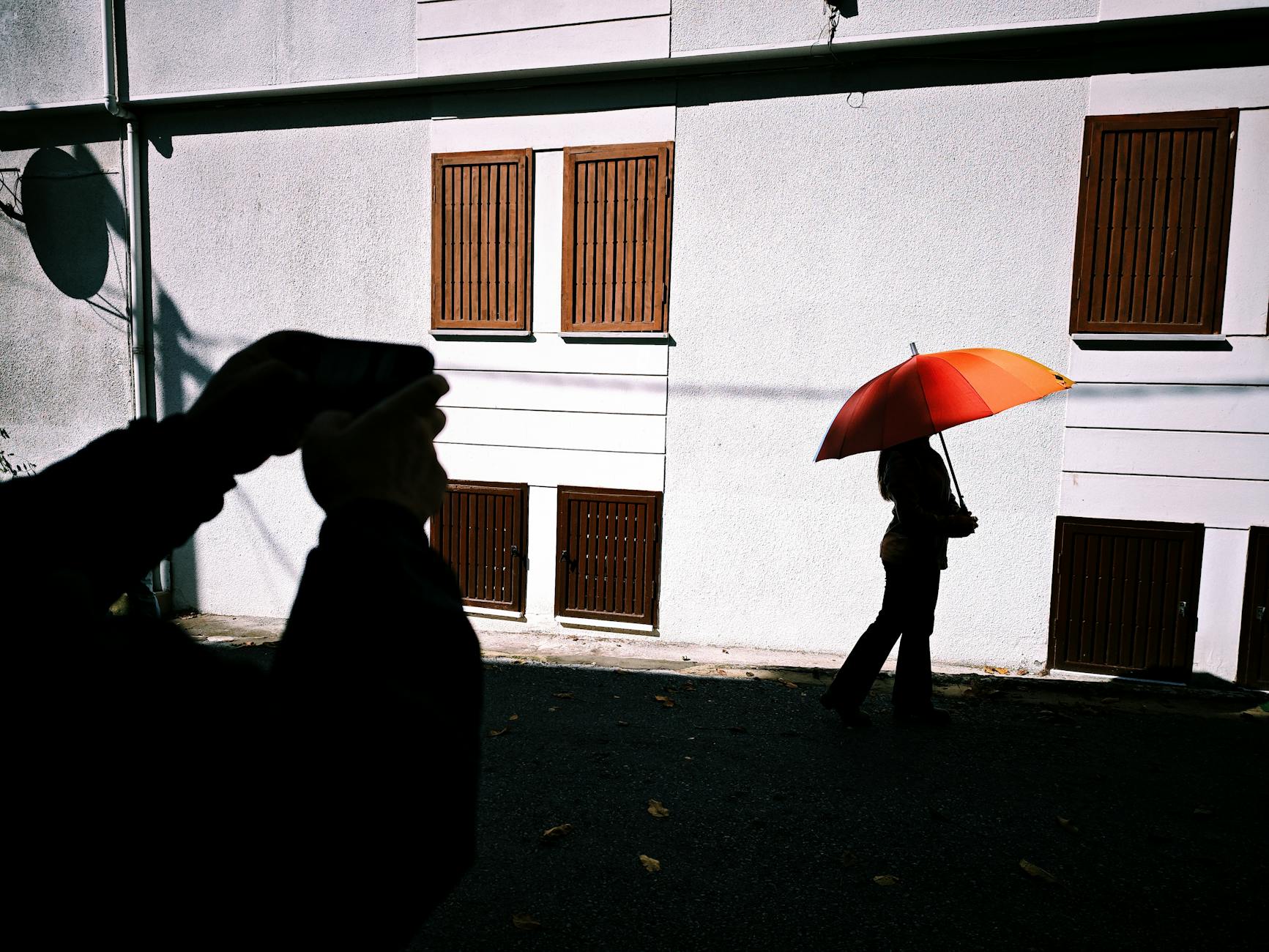 silhouette of person with parasol in istanbul street