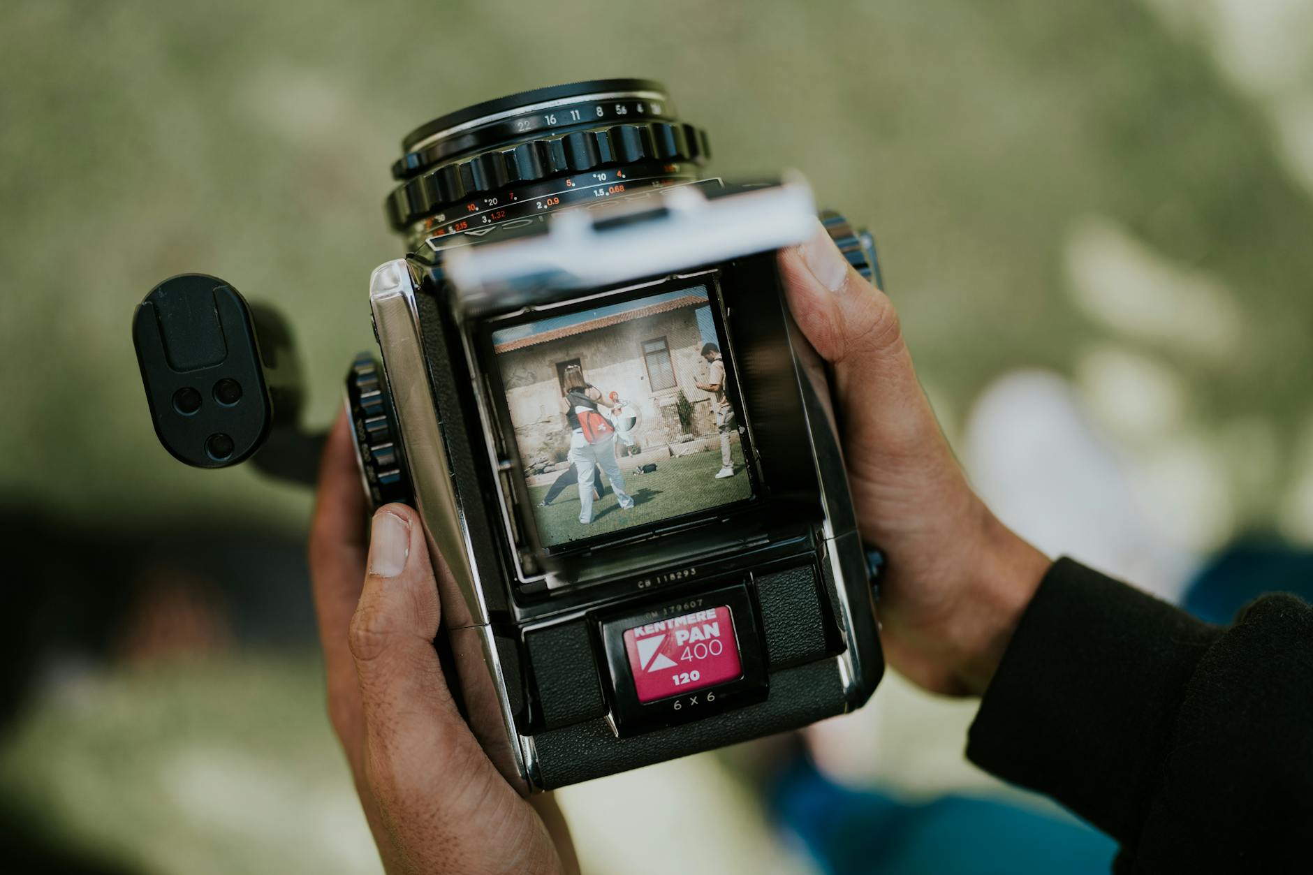 man hands holding camera