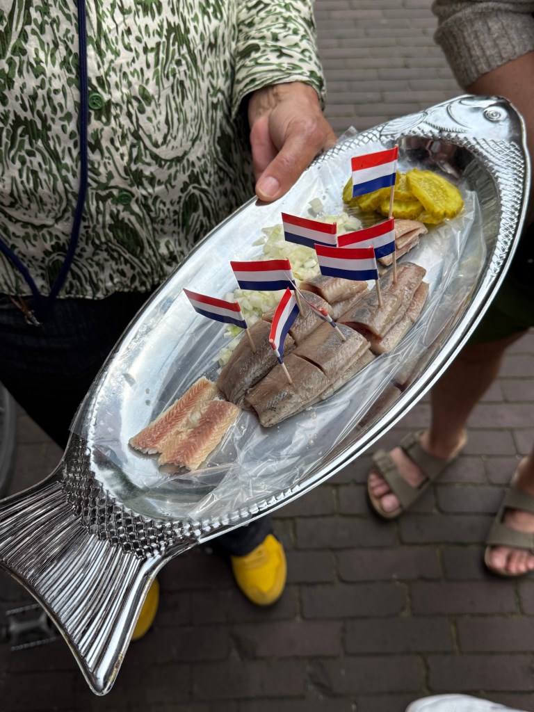 Traditional brined herring and eel on our Amsterdam food tasting tour.