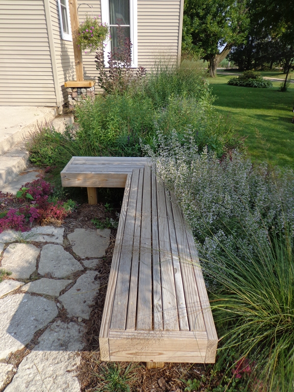 Custom bench adjacent to perennials