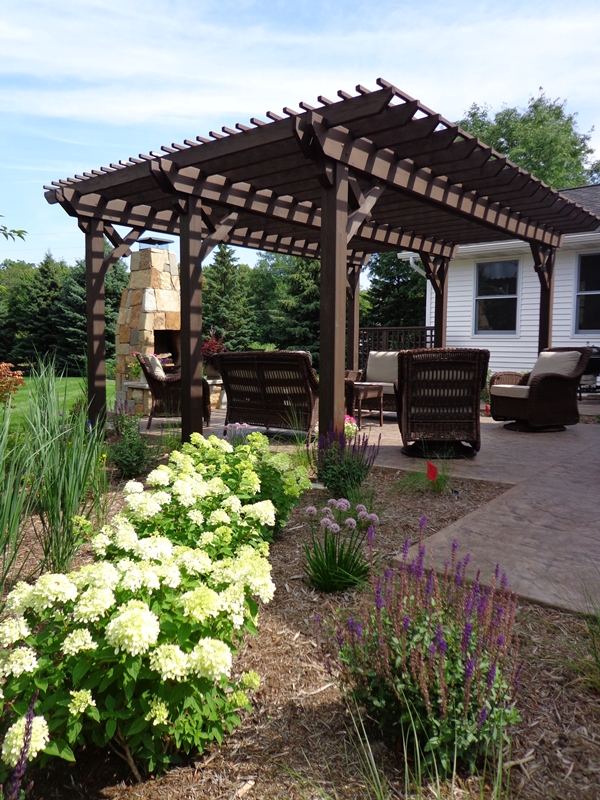 New shrubs and perennials installed near pergola