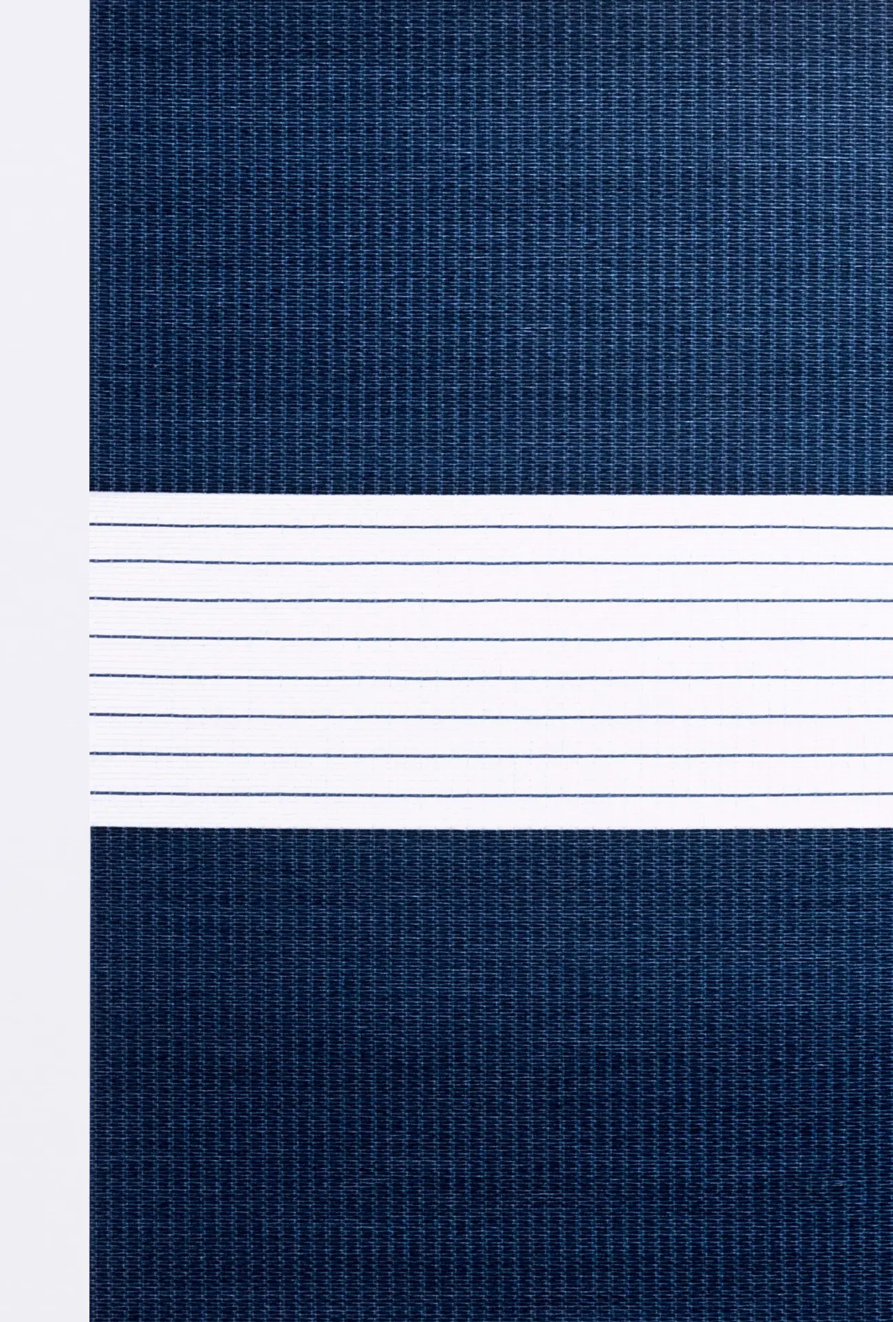 Denim zebra shade fabric swatch with alternating dark blue solid and white sheer bands.