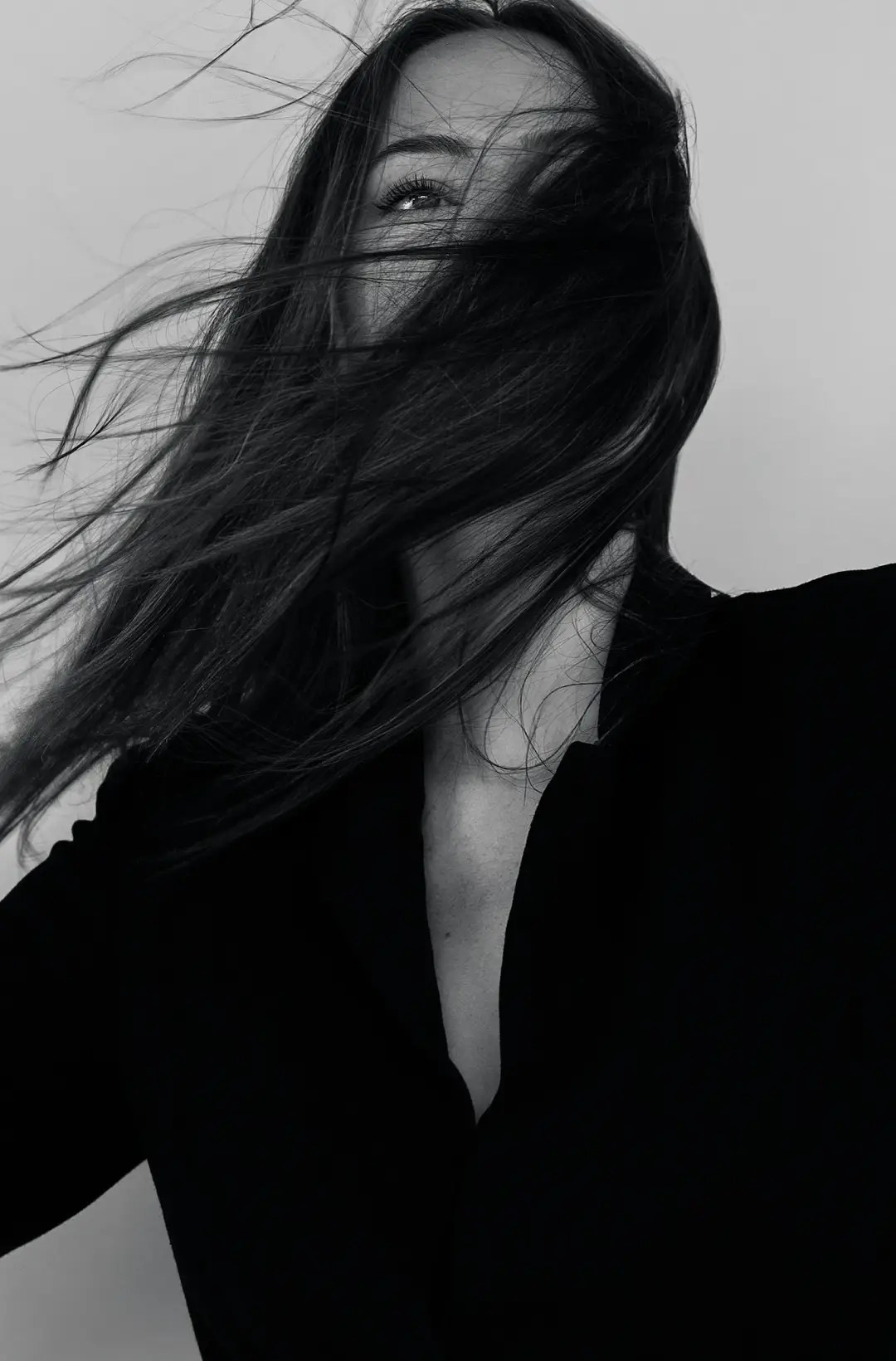 Black and white portrait of a woman with flowing hair