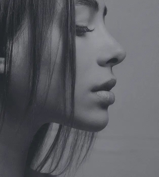 Black and white picture of young girl with beautiful nose silhouette after rhinoplasty