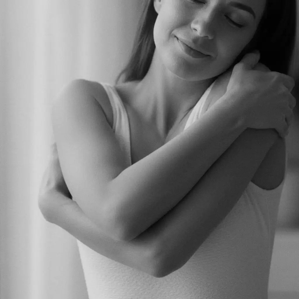 Woman hugging her arms