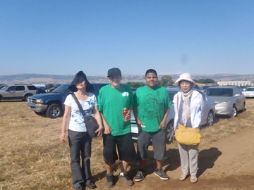 Tamiko and Sadako pose in the parking lot at the Gilroy Garlic Festival.
