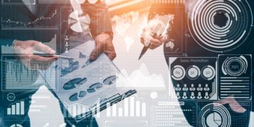 Big Data Technology for Business Finance Analytic Concept. Modern graphic interface shows massive information of business sale report, profit chart and stock market trends analysis on screen monitor.