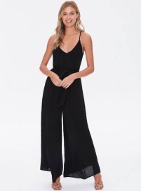 Woman wearing black wide leg jumpsuit