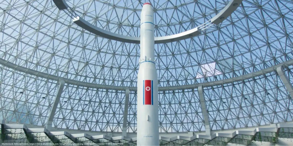 North Korean rocket displayed under a glass dome, illustrating the resilience of sanctioned regimes—an image exploring the question: Do Economic Sanctions Work?