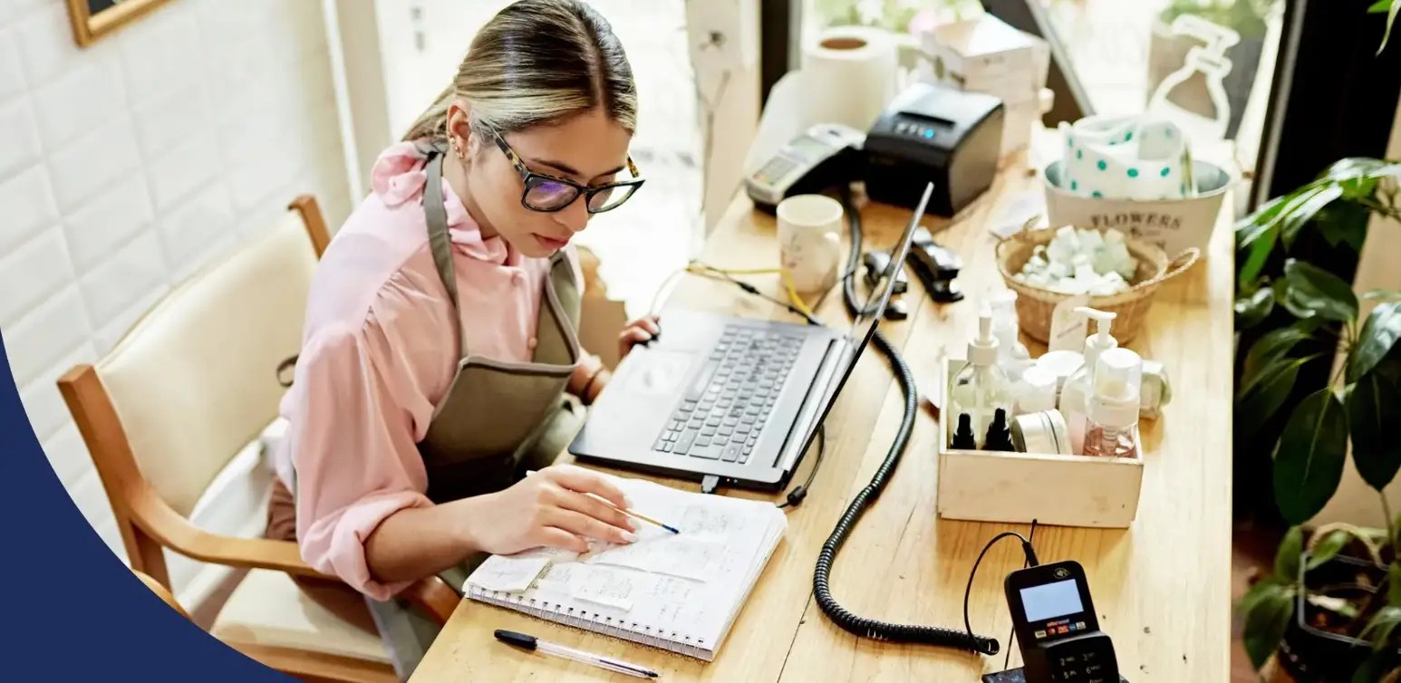 Contract services business person reviewing and entering data