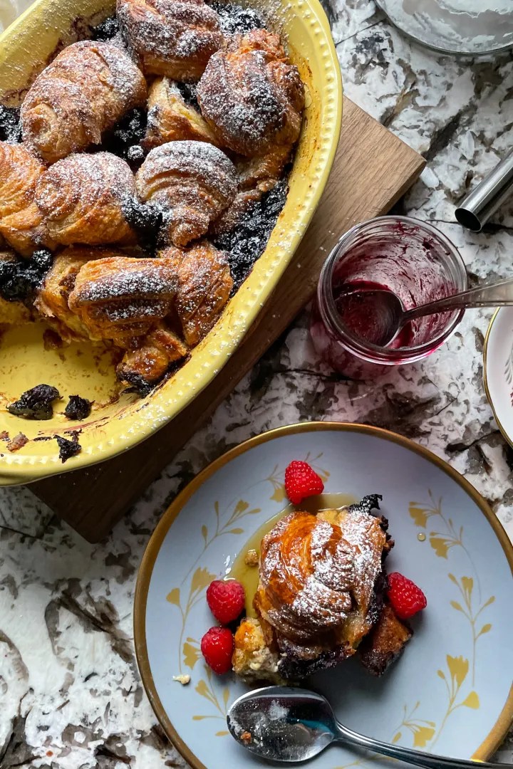 Golden, buttery croissants baked with blueberries in a rich custard and garnished with powdered sugar