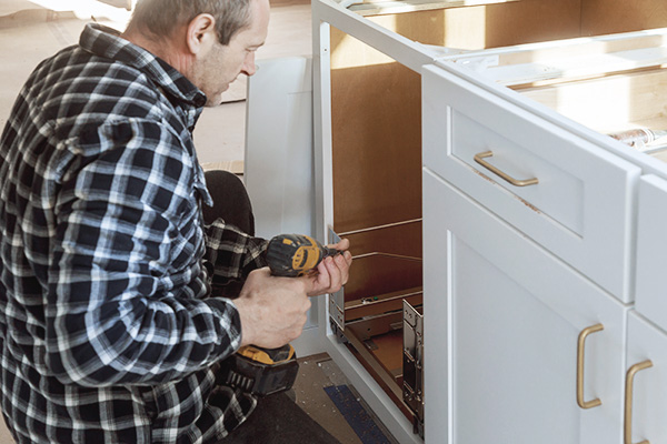 cabinet contractor installing home cabinets