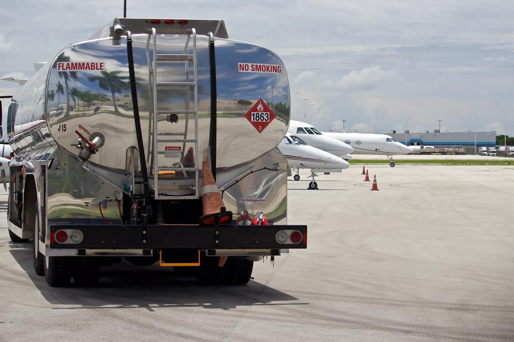 Jet A fuel tanker positioned near aircraft on an airport apron