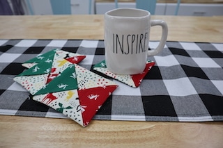 Inspire Mug on Coast and three other Coasters laying next to it