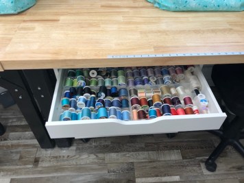 Draw pulled open showing thread
