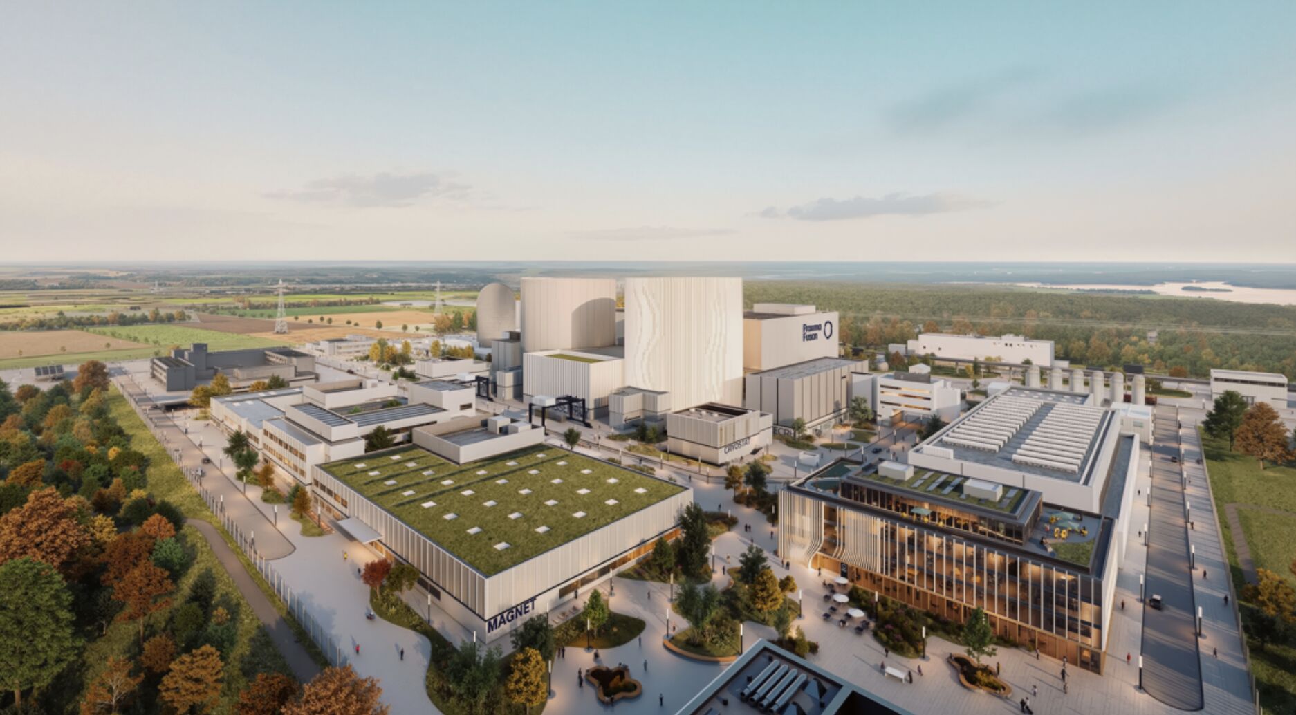 Aerial architectural render of a Proxima Fusion stellarator power plant campus, showing a large central reactor building bearing the Proxima Fusion logo alongside a dedicated magnet facility, illustrating the industrial scale-up the company is targeting through its new Industrial Development Board.