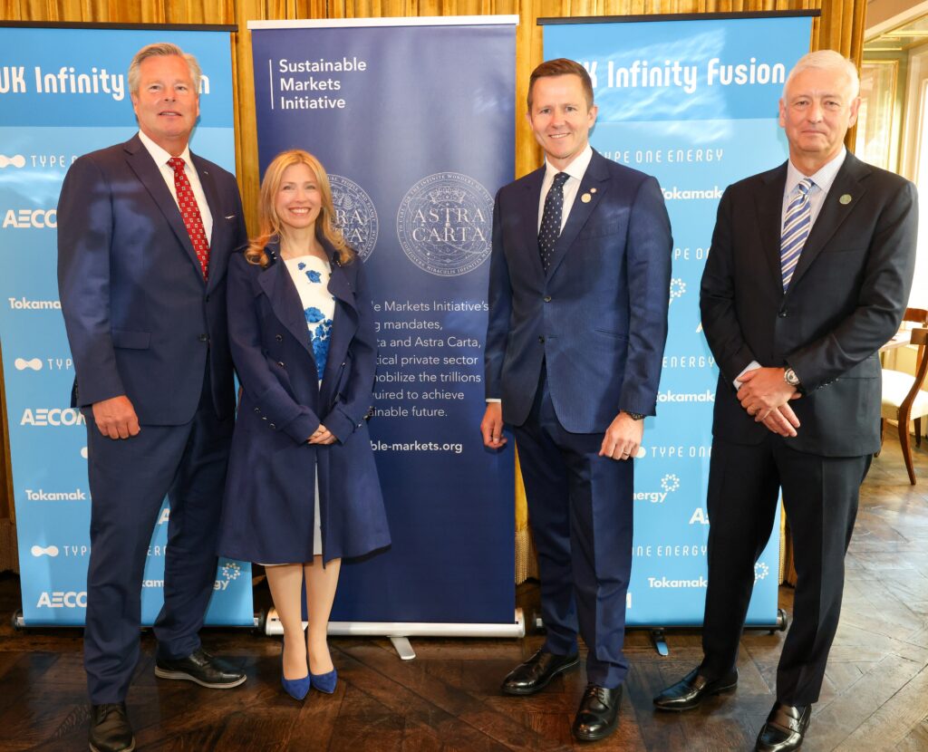 From left to right, Chris Mowry, CEO of Type One Energy, Jennifer Jordan-Saifi, CEO of the Sustainable Markets Initiative, Warrick Matthews, CEO of Tokamak Energy, and Troy Rudd, Chairman and CEO of AECOM, gather before UK Infinity Fusion Consortium and Sustainable Markets Initiative Astra Carta banners, marking the launch of the first private-sector-led fusion power plant project in the United Kingdom.