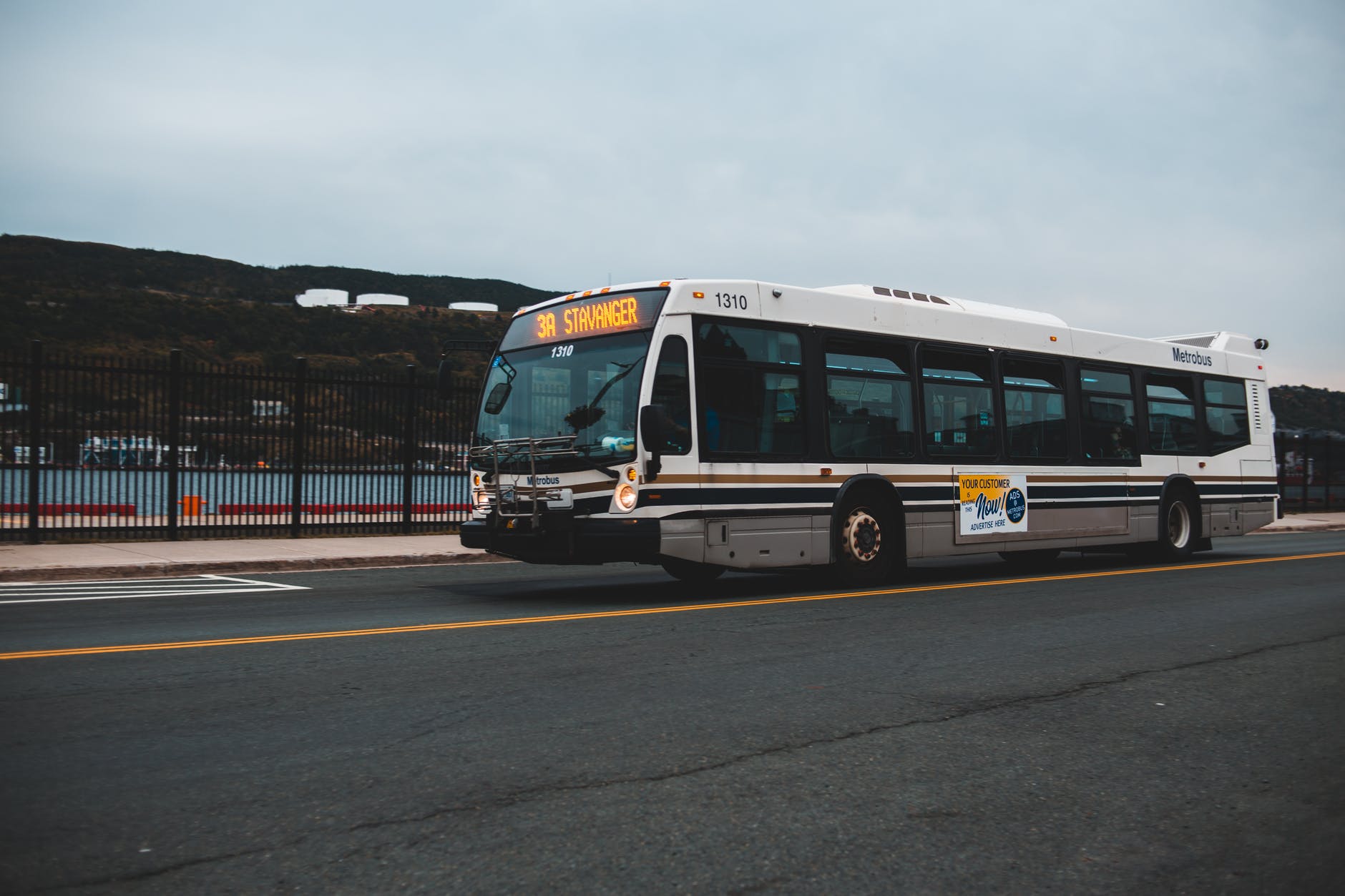 gray bus on asphalt road