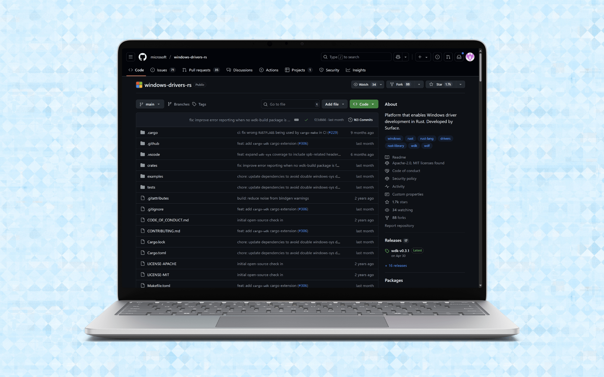 Microsoft Surface Laptop with a GitHub page on screen.