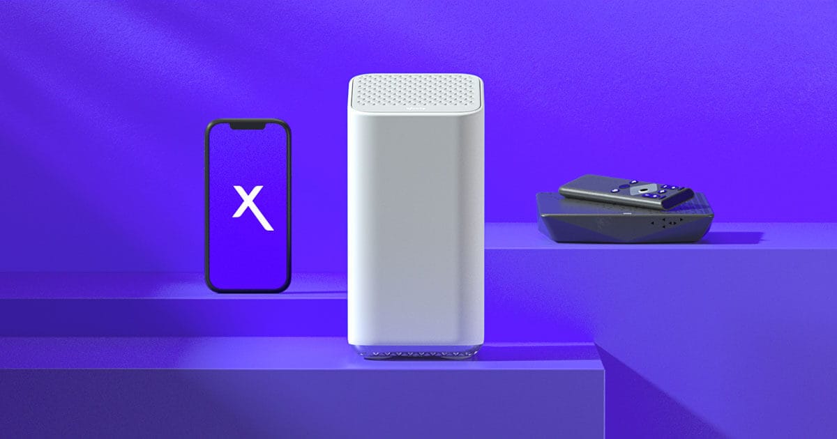 Xfinity devices displayed on a purple shelf, including a smartphone with the Xfinity logo, a white WiFi gateway, and a streaming remote resting on a TV box.