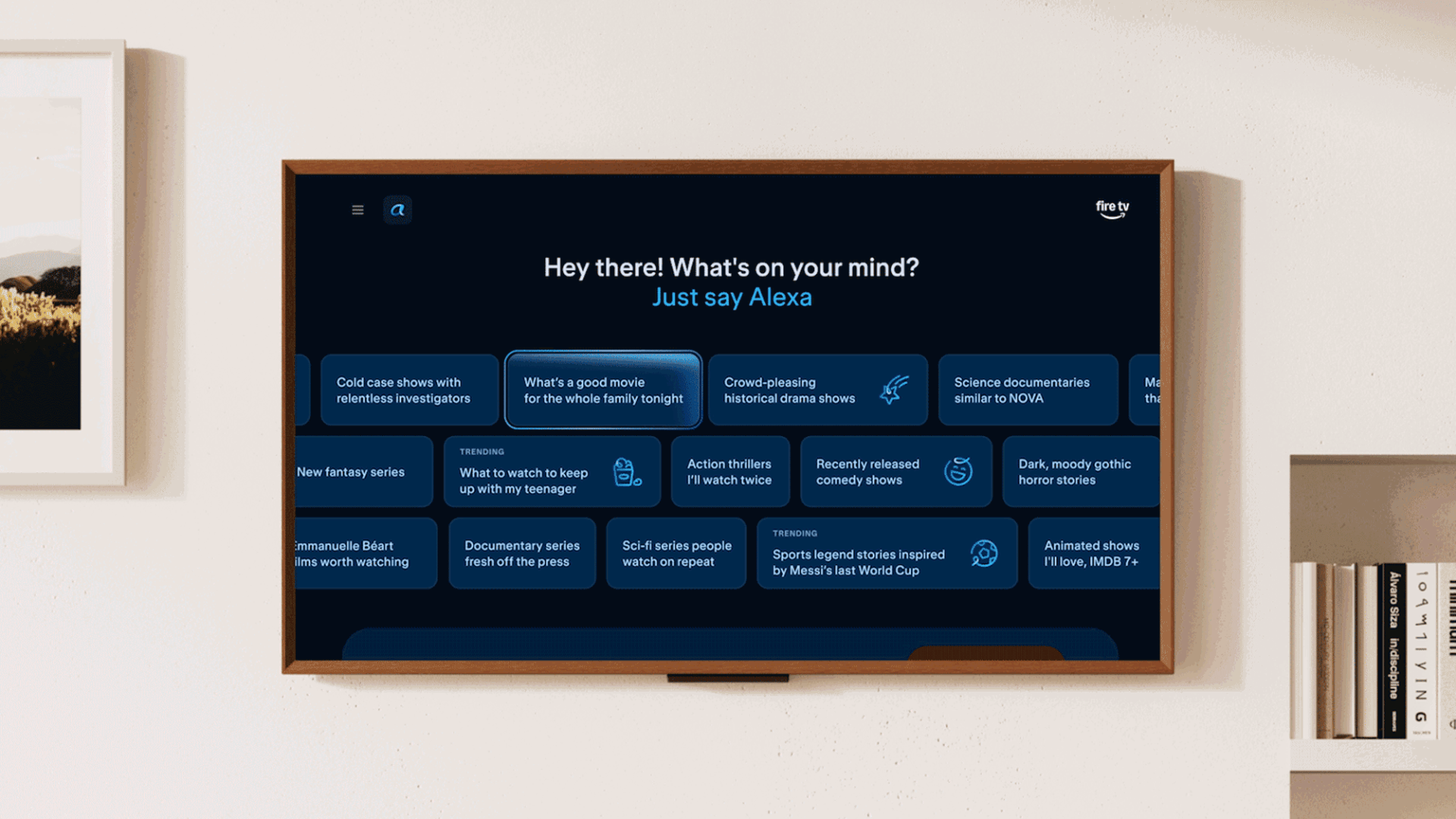 Fire TV screen prompting 'Hey there! What's on your mind? Just say Alexa' above various suggestion tiles.