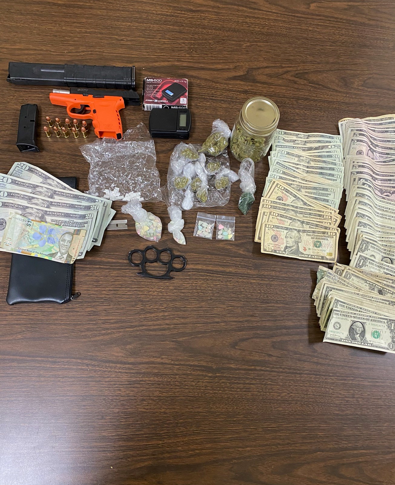 Quincy police report retrieving gun, drugs, and cash from traffic stop