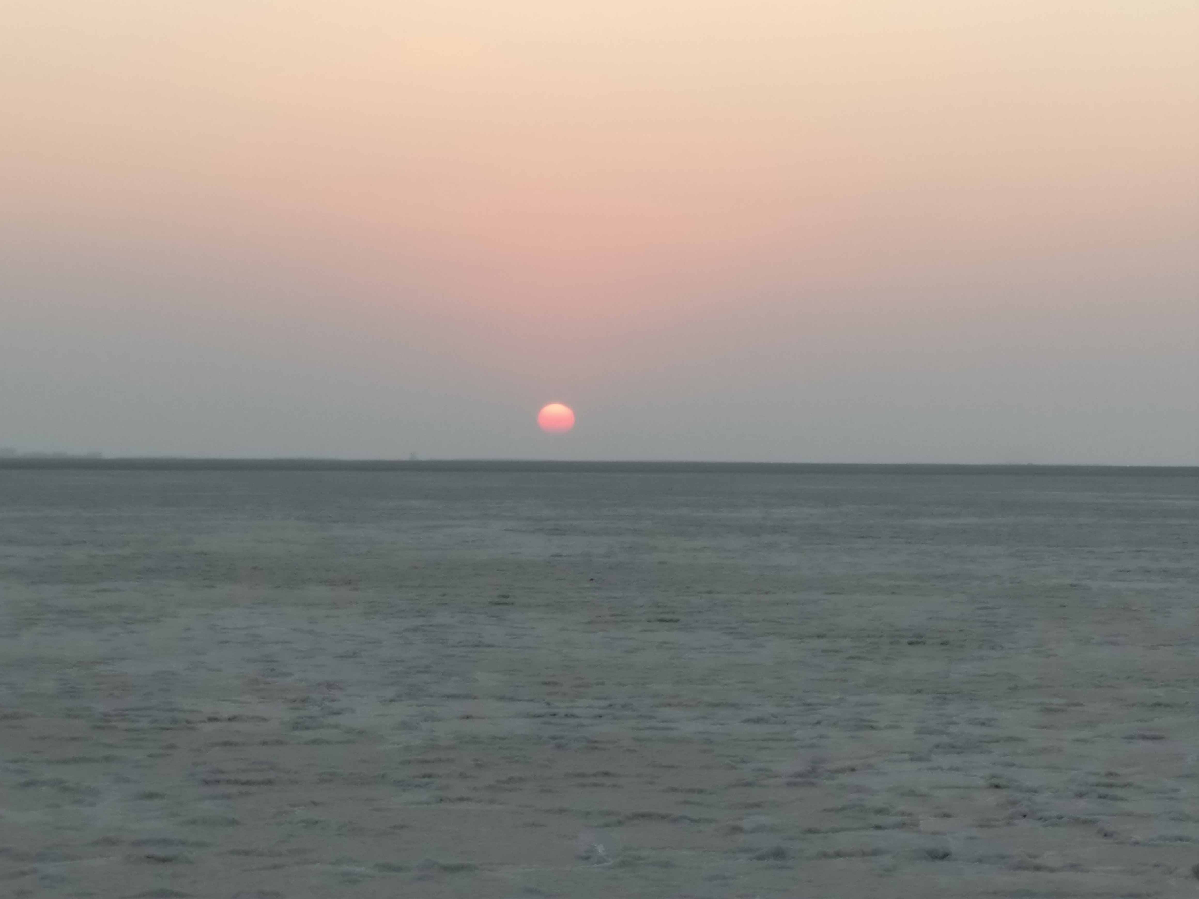 Sun setting over a sea of salt of