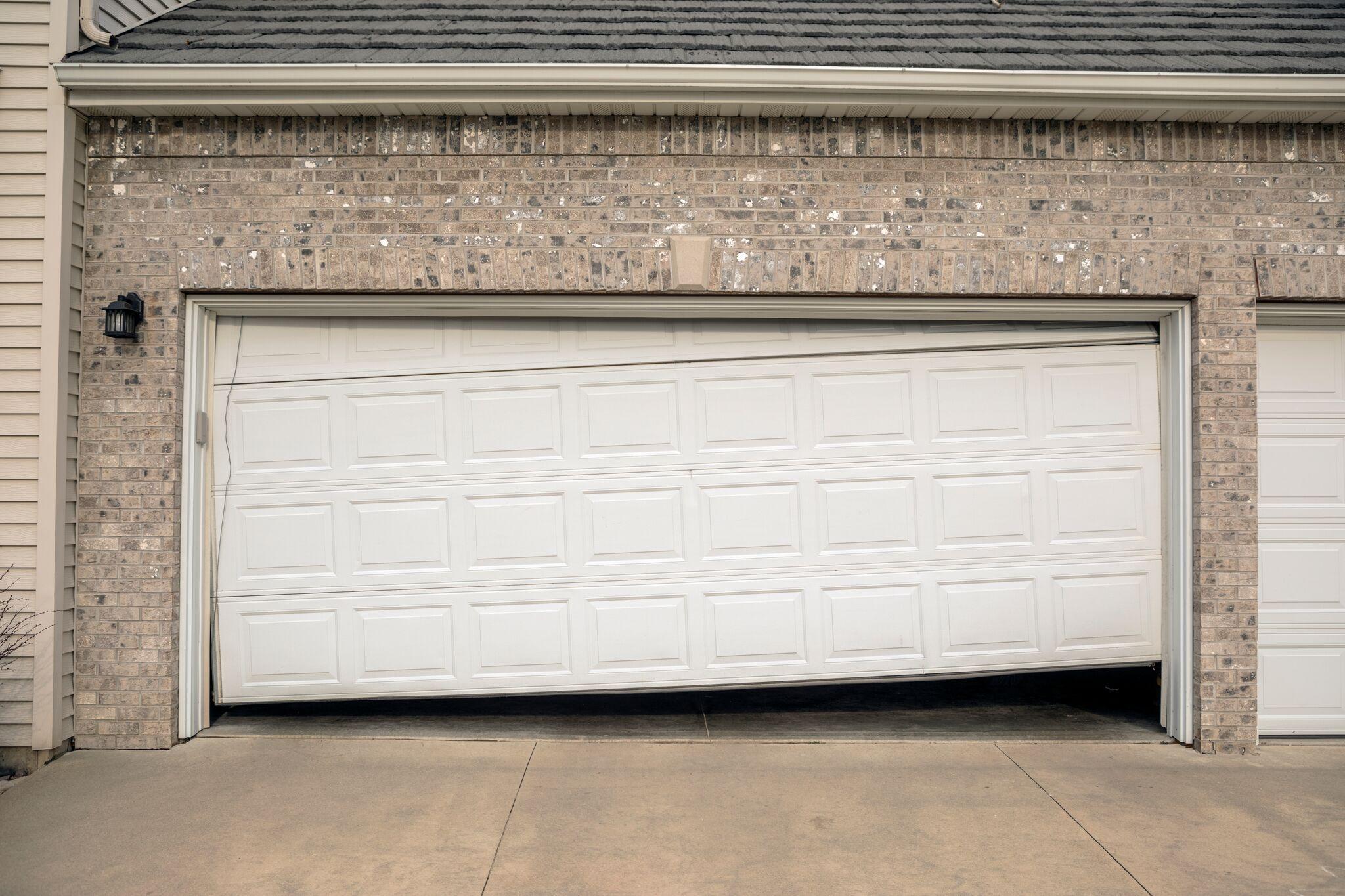 Why garage door makes clicking noise won't open?