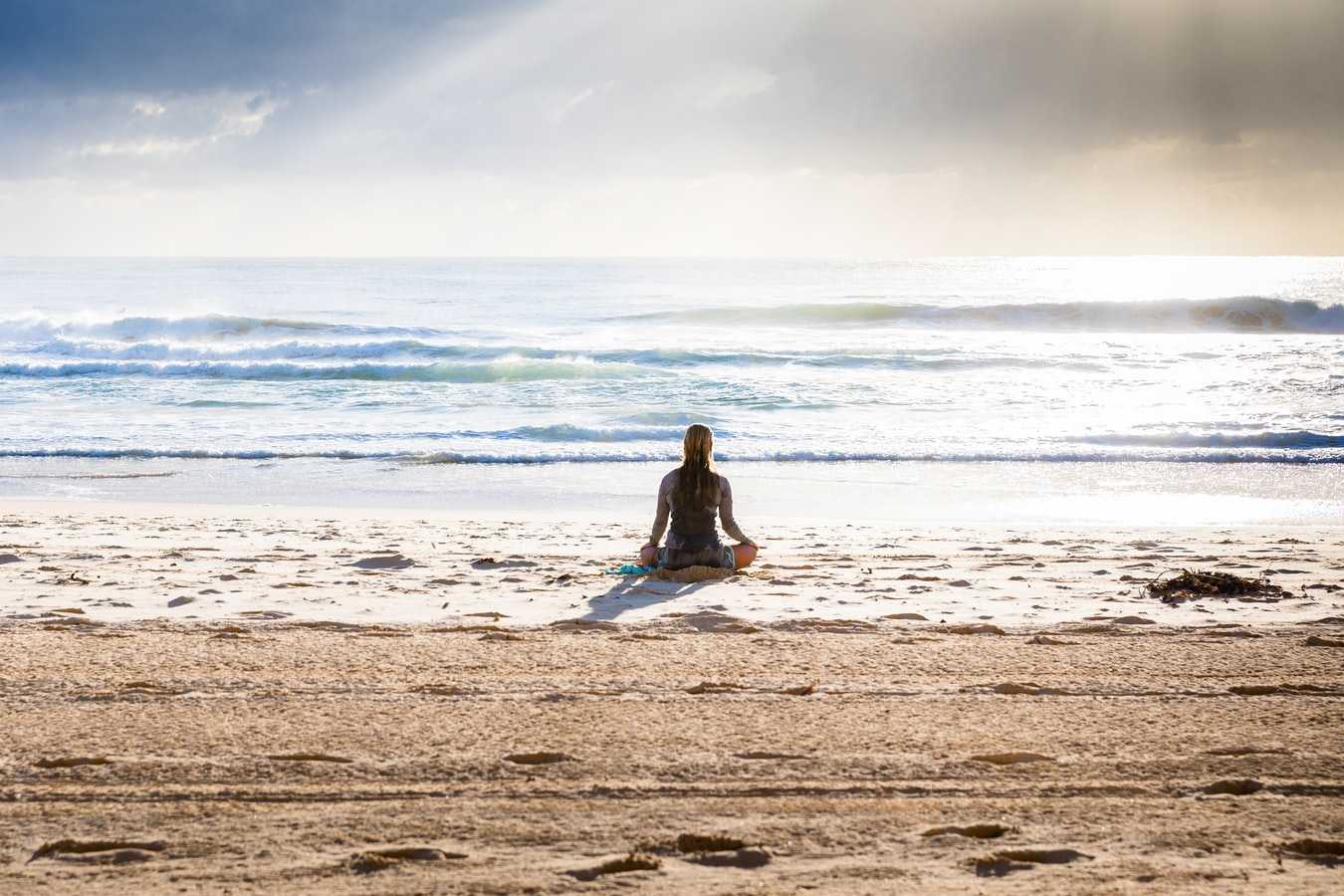lady sitting on a beach