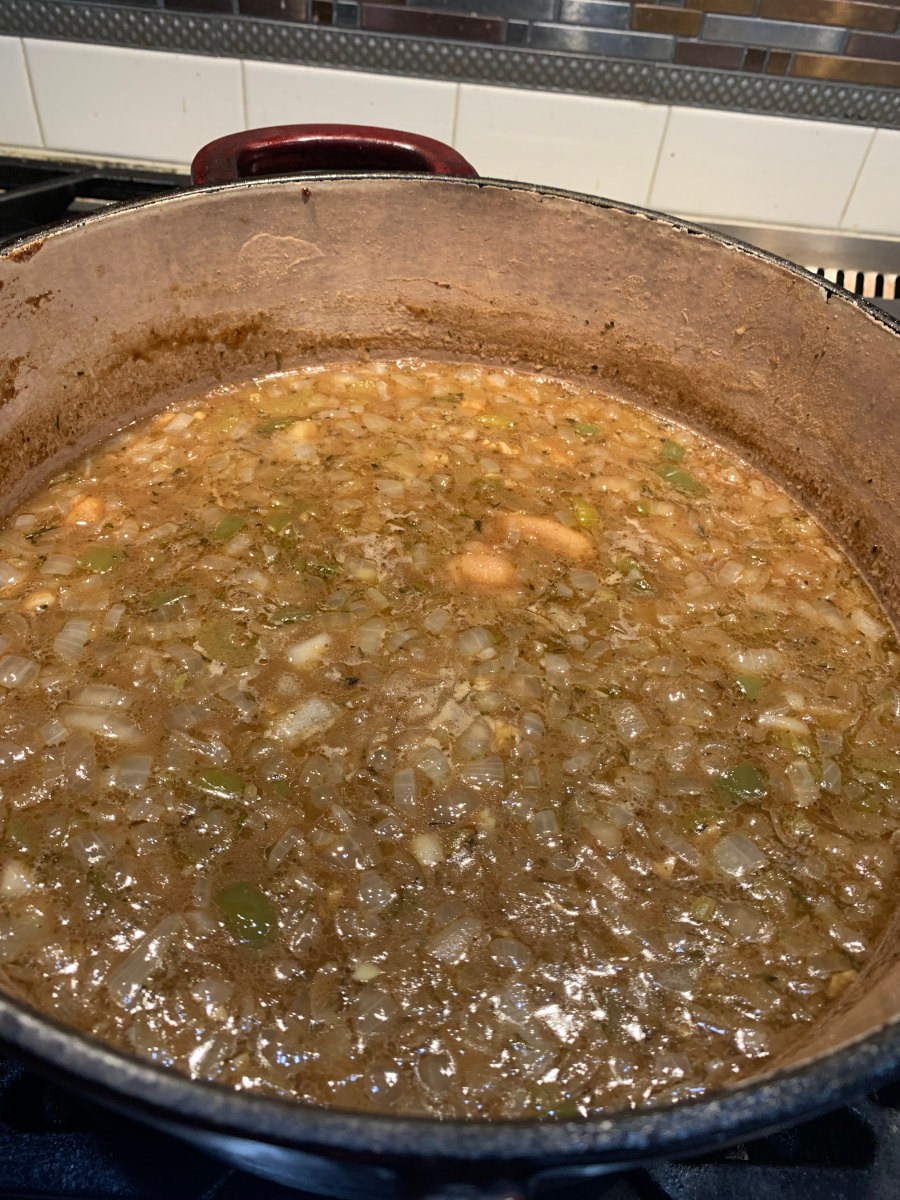 Chicken Gumbo - stock and vegetables simmering in a Dutch oven.