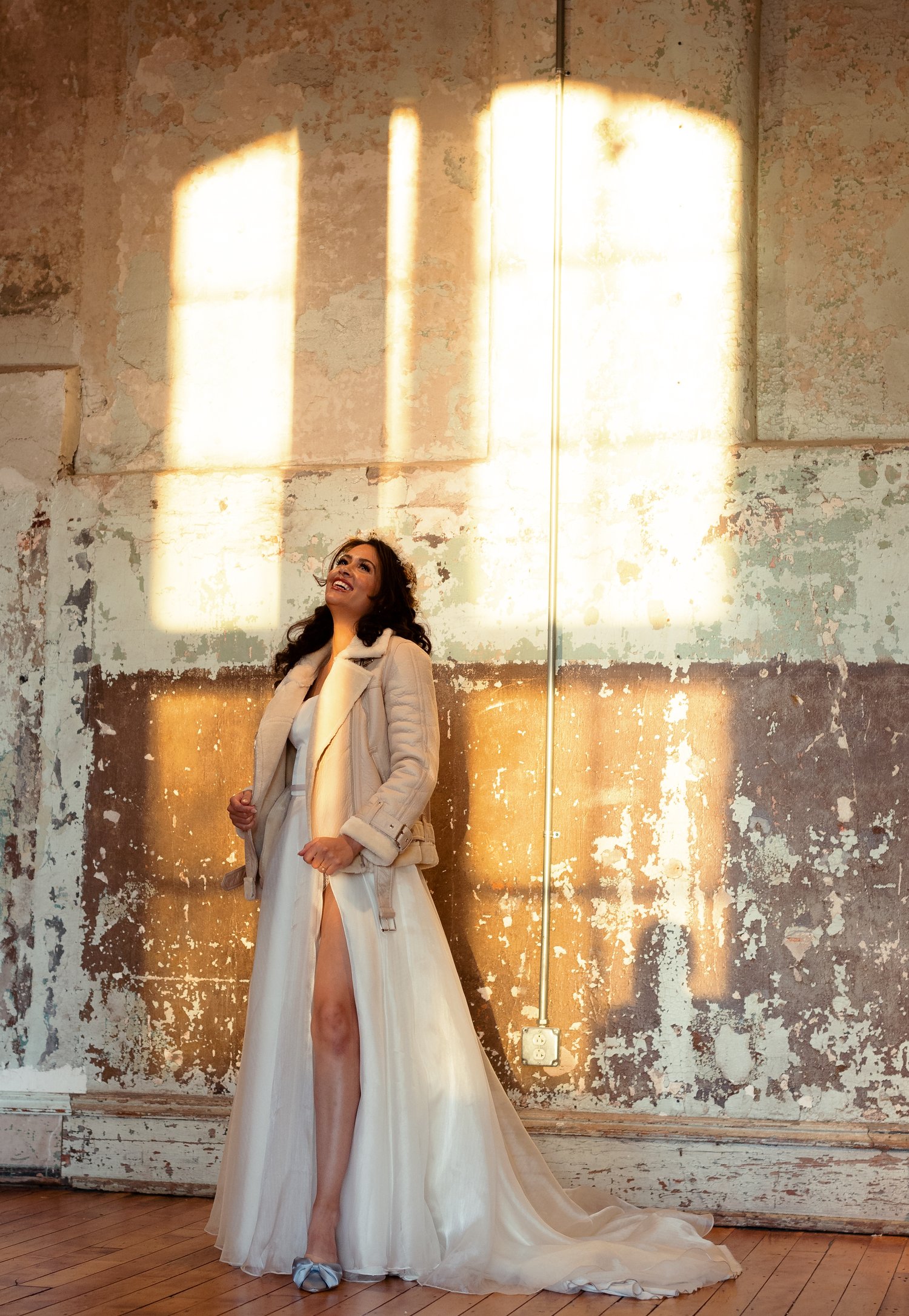 Bride laughing wearing a fur jacket. Columbia Wedding Photographer