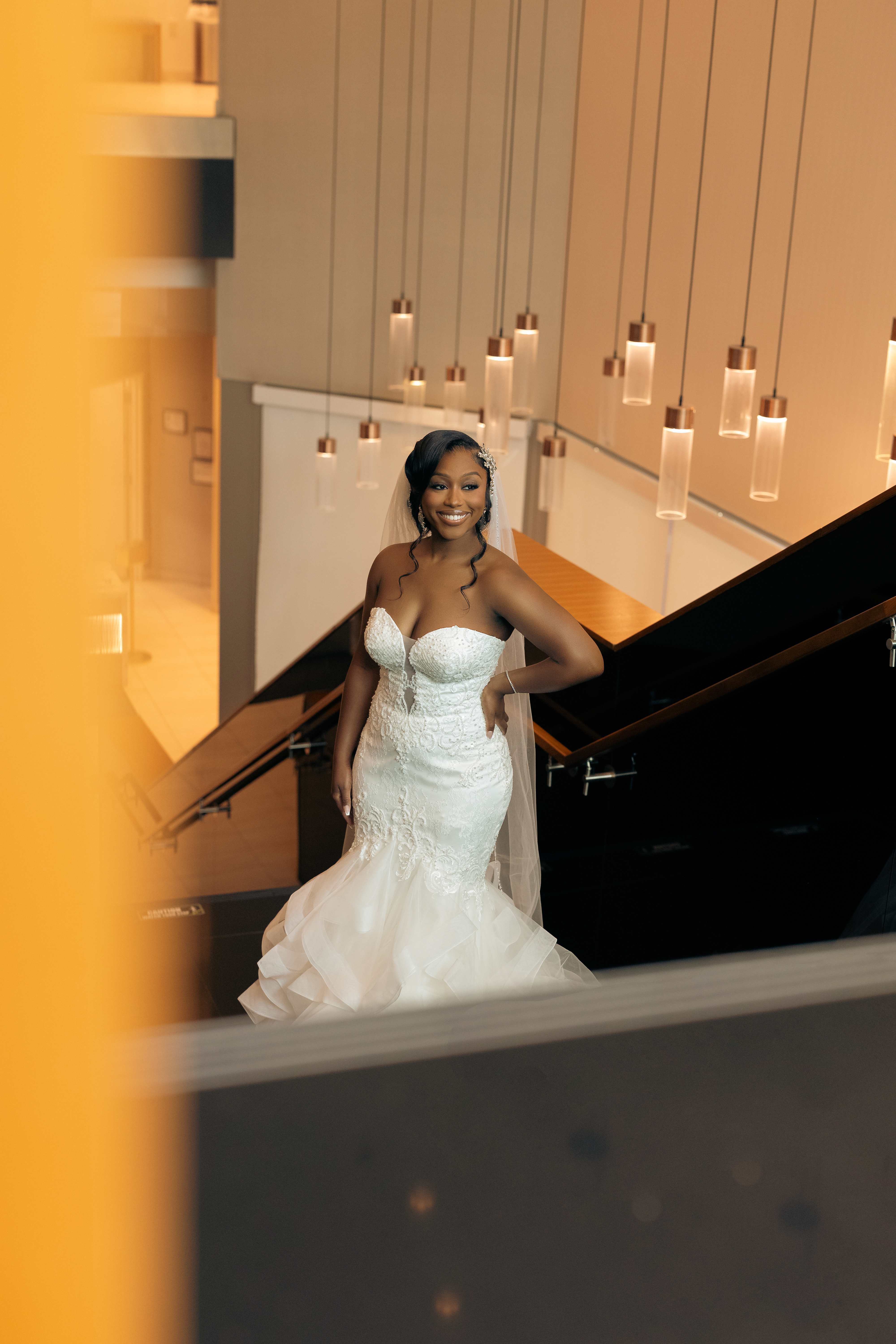 Bride on Grand Staircase SpringHill Suites Charlotte Center City Wedding Venue