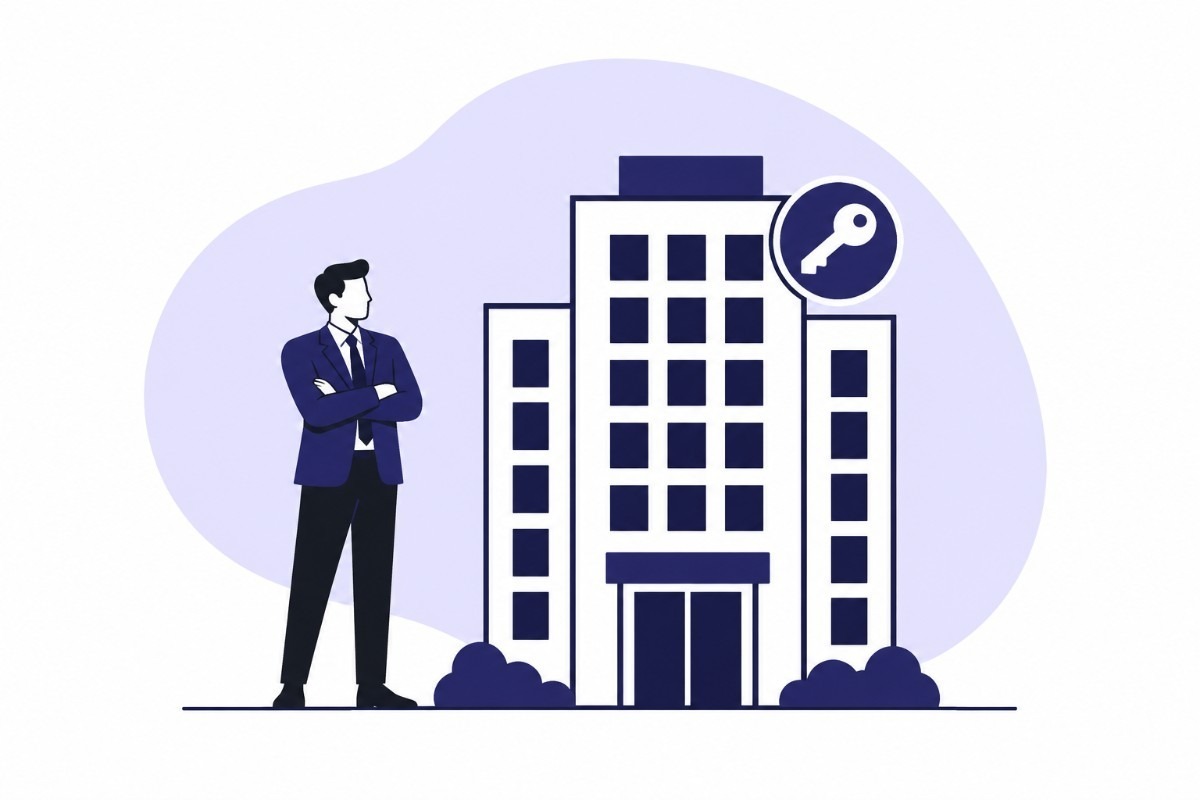 Businessman standing beside an office building with a key symbol, representing business ownership and corporate setup.
