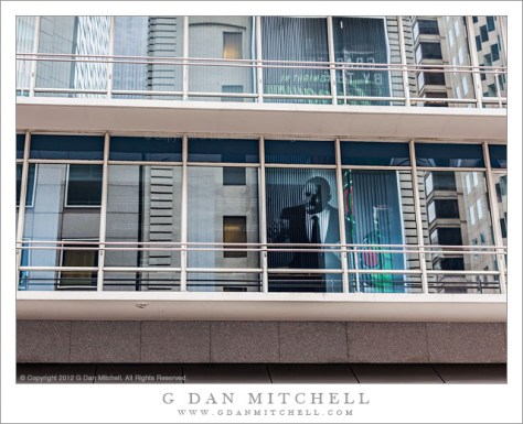 Man in the Window - Reflections in the windows of a financial district building, San Francisco, California