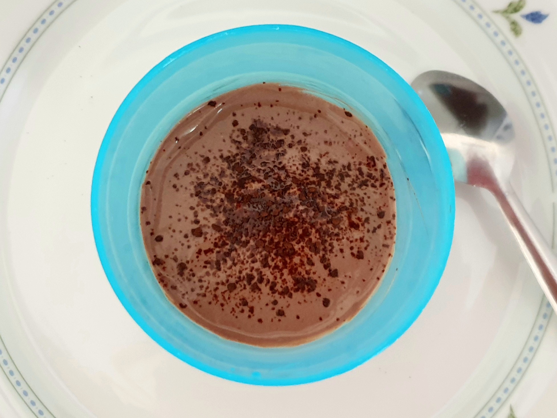 coffee and chocolate mousse served in a blue plastic bowl