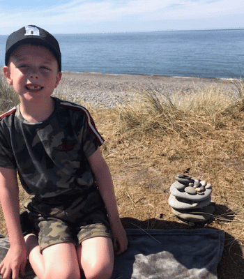  - Rebecca House this week announced that their friend, 8-year-old Dylan Walton, would be taking on his own walking challenge to raise money for the charity. Dylan, who has a rare condition involving conditions such as Cerebral Palsy and Epilepsy, has been visiting Rebecca House since 2013. On the 25th July, Dylan will be attempting to walk the 620m climb of Snaefell Mountain, completing the first 414m at the NSC before climbing the remaining 206m up from the Bungalow, alongside his family and members of Rebecca House, including CEO Anne Mills. Dylan is hoping to be able to give back to the people who have helped him so much with his mum Lucy saying they've 