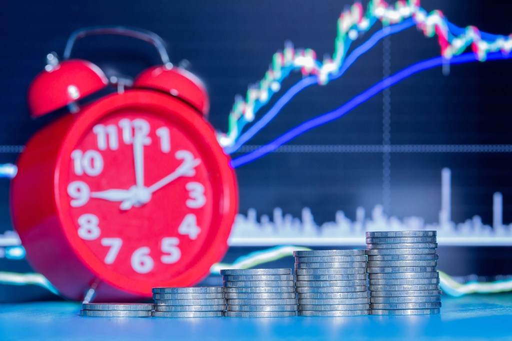 stack-of-coins-and-clock