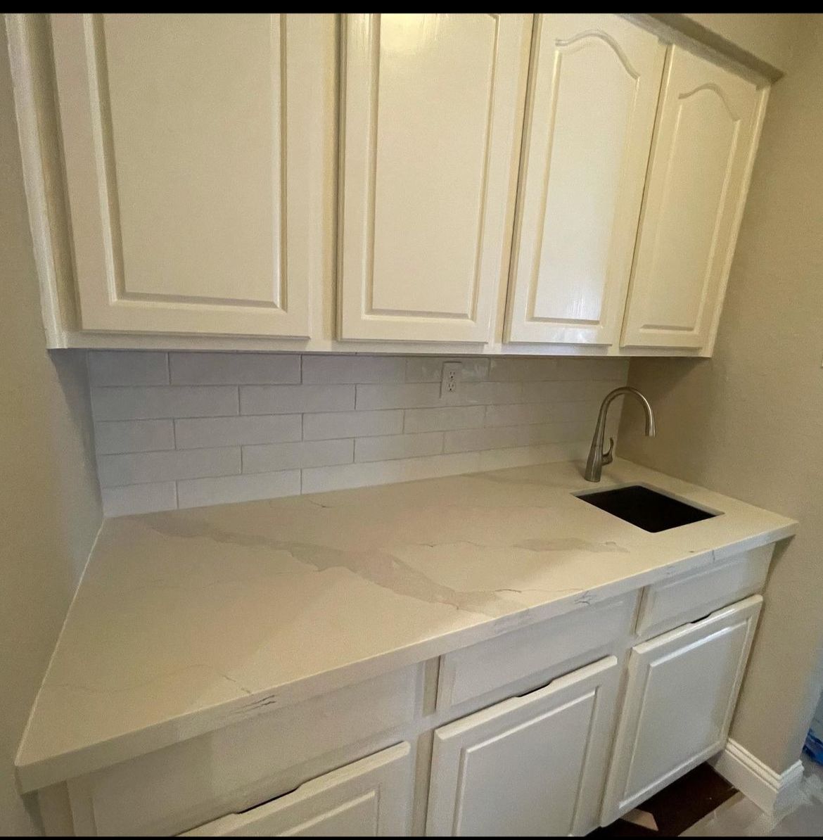 Counter top, backsplash and faucets. River Oak