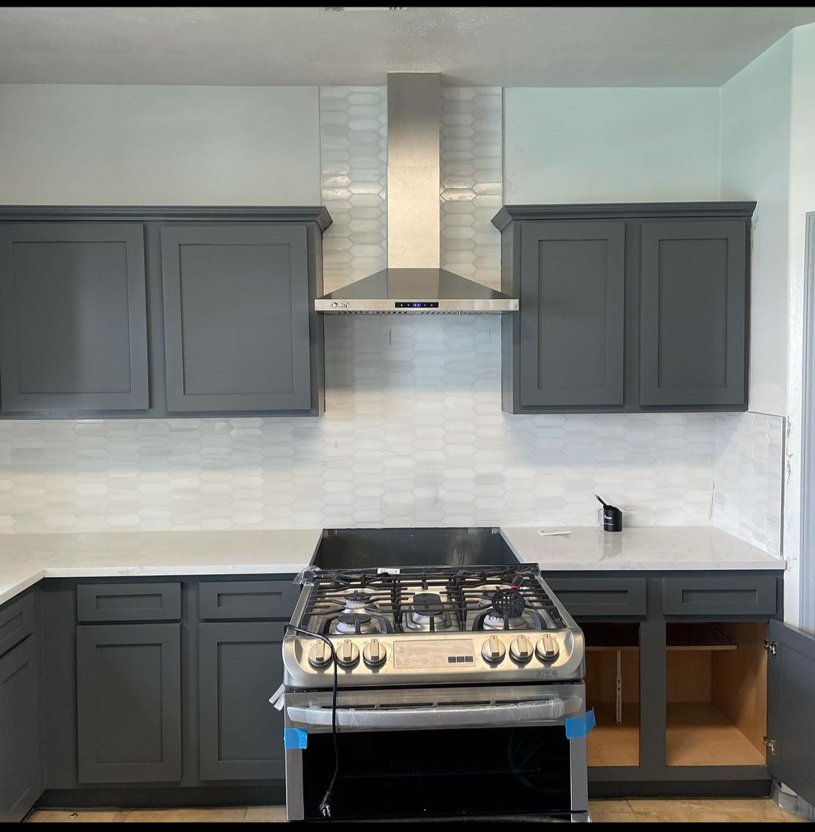 Installation of backsplash and range hood - Katy