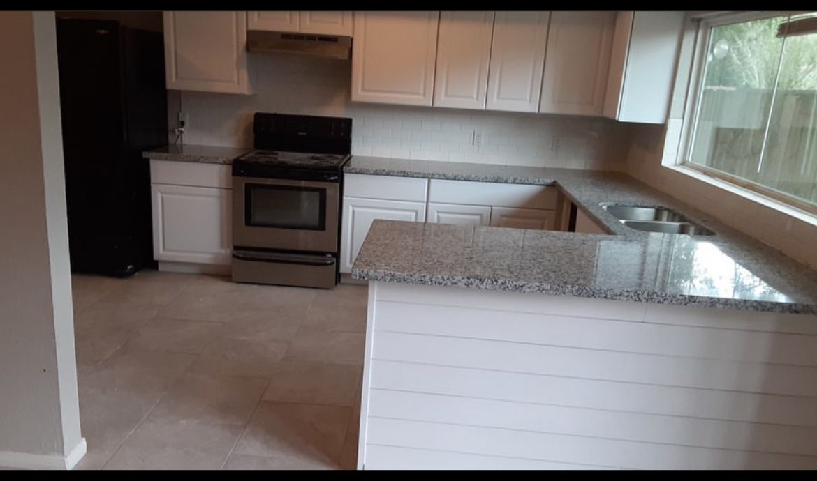 Kitchen remodeling, cabinets, backsplash, countertop and range. Spring