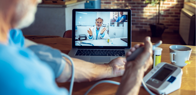 Man speaking with doctor via telehealth