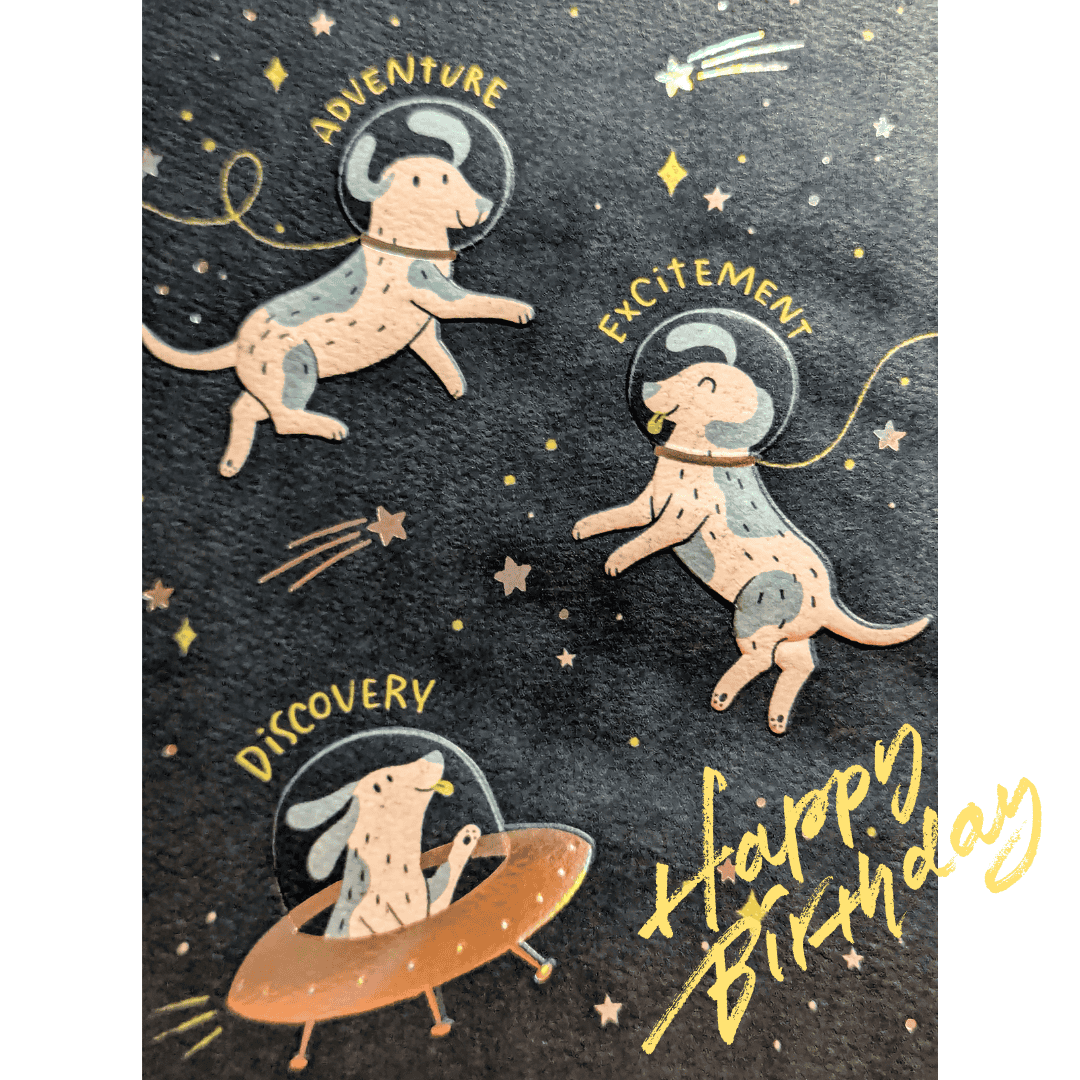 Cartoon dogs with astronaut helmets float through space