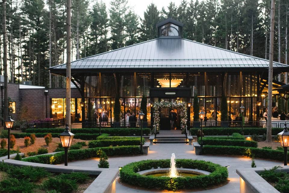 European style wedding venue with lots of windows, manicured gardens and amazing architecture