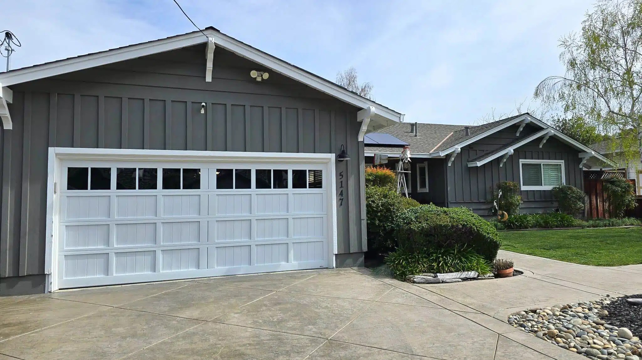 Dustin Cantu working on a garage door — Concord, CA