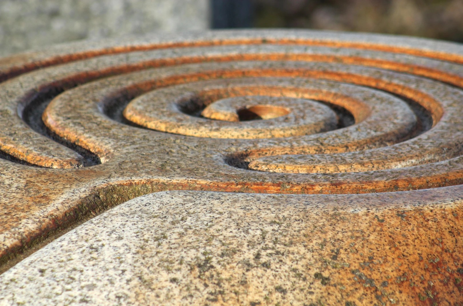 Close-up of a spiral stone labyrinth symbolizing inner journey and mindfulness